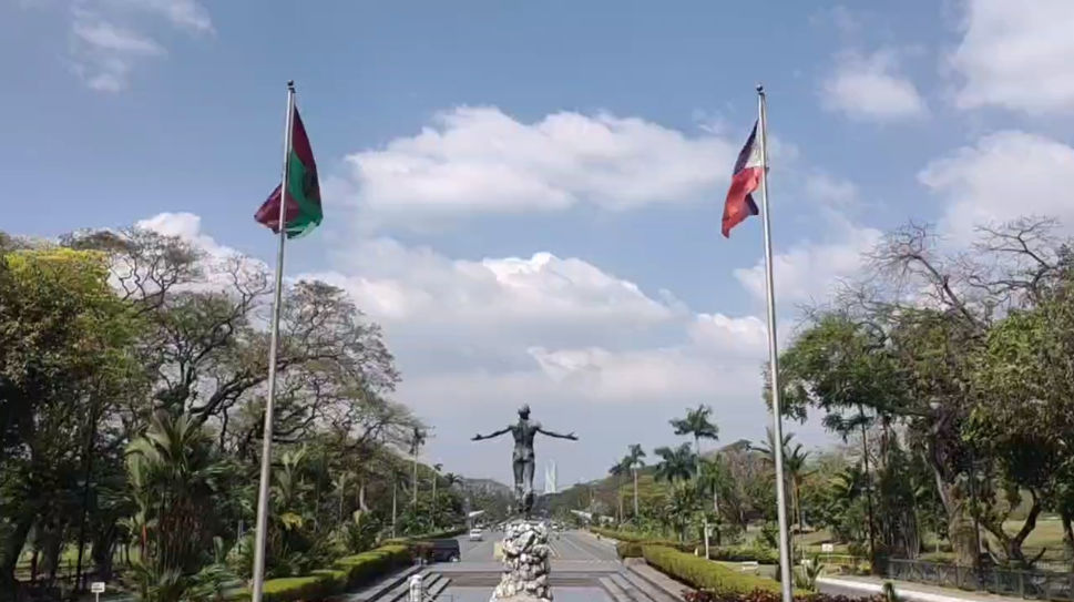 Landscape view of the University of the Philippines oblation statue and panorama